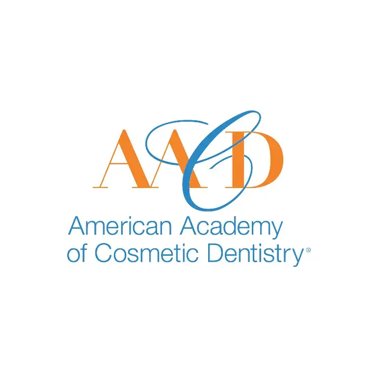 AACD logo featuring stylized letters and dental brush symbolizing American Academy of Cosmetic Dentistry membership.
